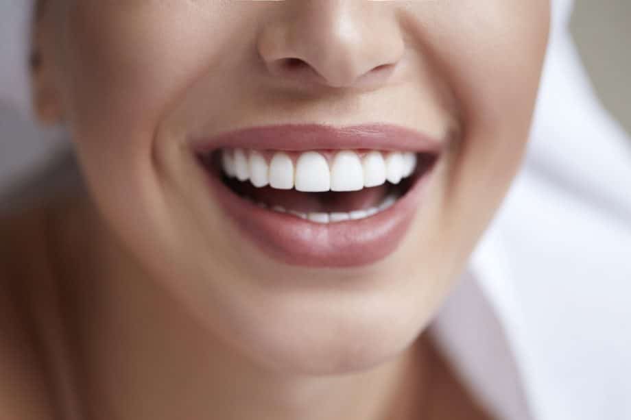 Close Up Of Woman Smiling With Straight Teeth