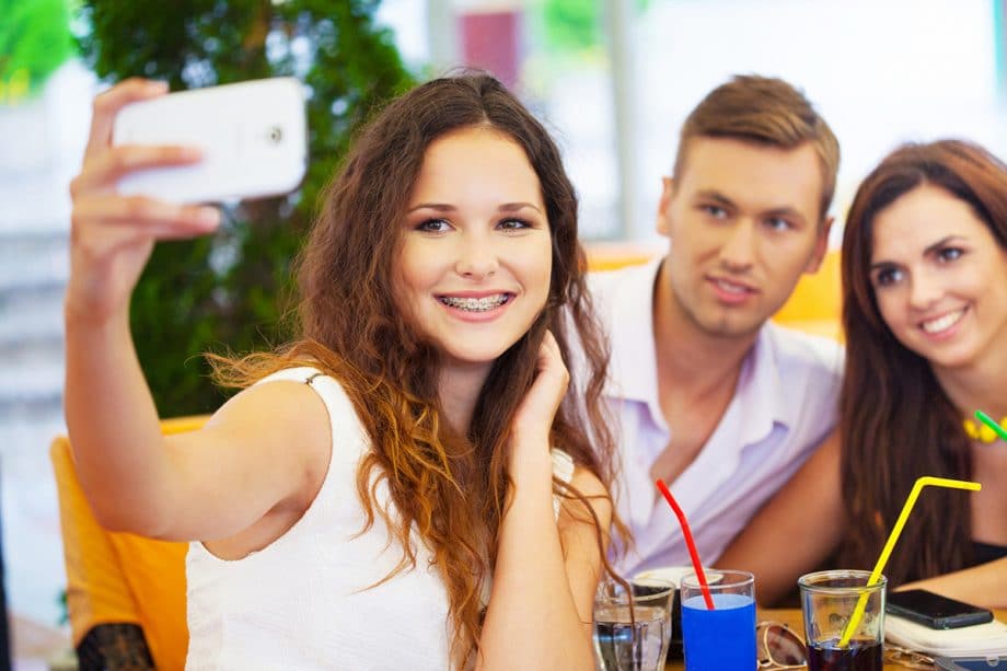 teens taking selfie