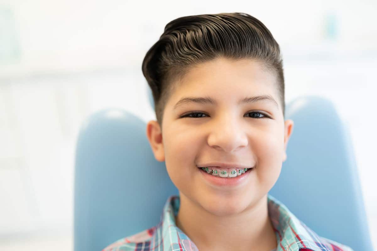 young boy with braces, smiling